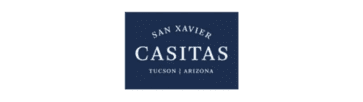 A blue sign with white text reads "San Xavier Casitas, Tucson, Arizona.